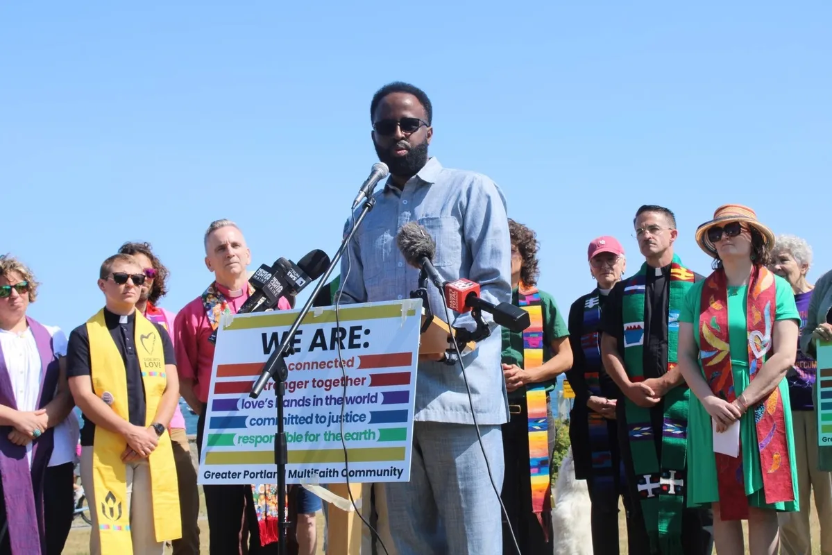 Dr. Ahmed speaking to a community audience